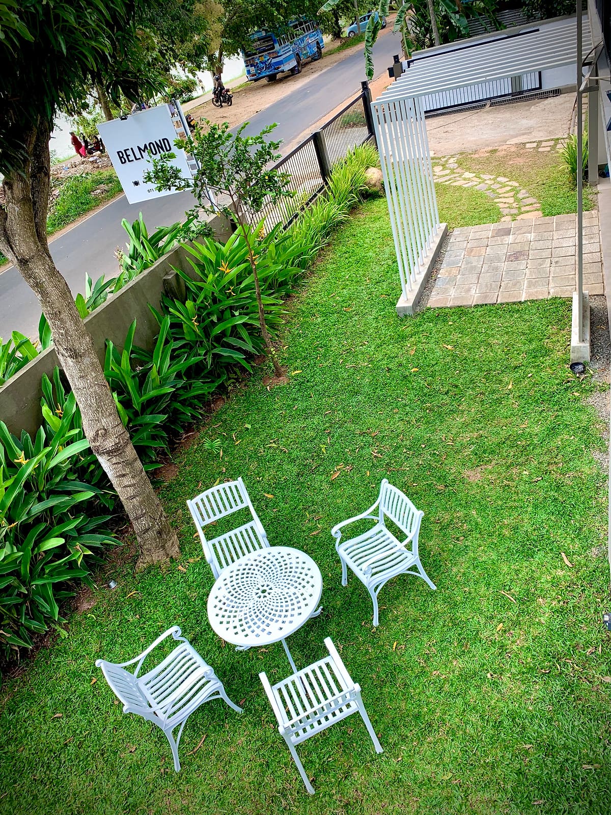 White garden table and chairs on the lawn at DELMOND Lake
